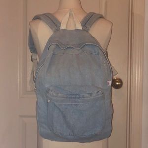 Light wash denim backpack